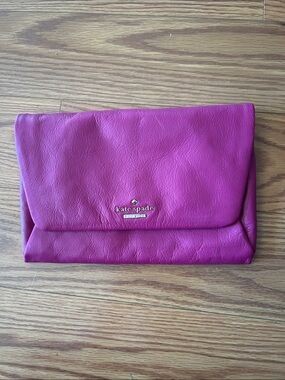 kate spade magenta leather foldover clutch with gold logo